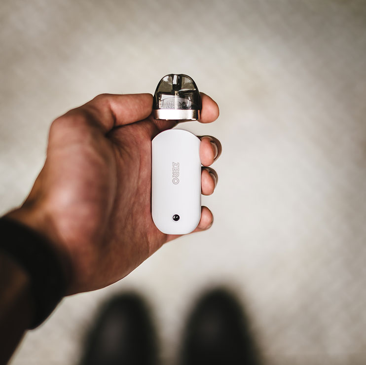 Person Holding Vape Pod